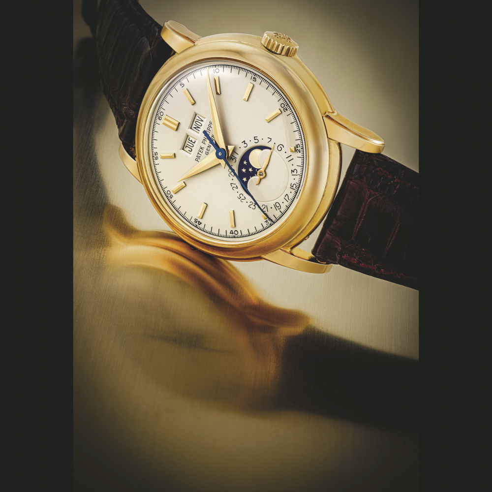 PATEK PHILIPPE. A RARE 18K GOLD PERPETUAL CALENDAR WRISTWATCH WITH SWEEP CENTRE SECONDS AND MOON PHASES