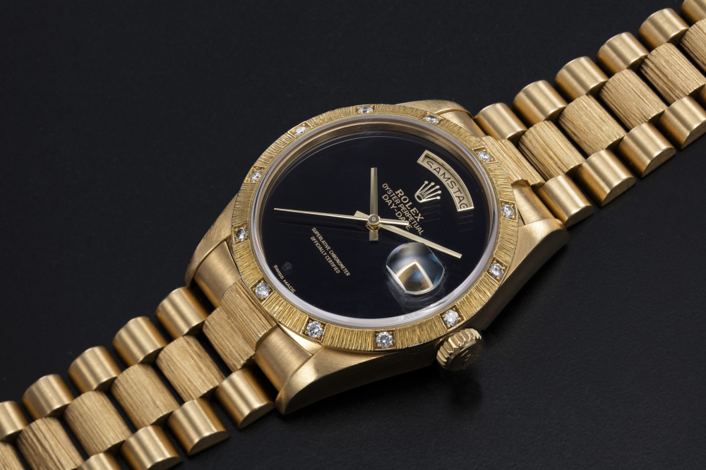 ROLEX, A GOLD OYSTER PERPETUAL DAY-DATE WITH DIAMOND BEZEL AND ONYX DIAL, REF. 18108 - CASE