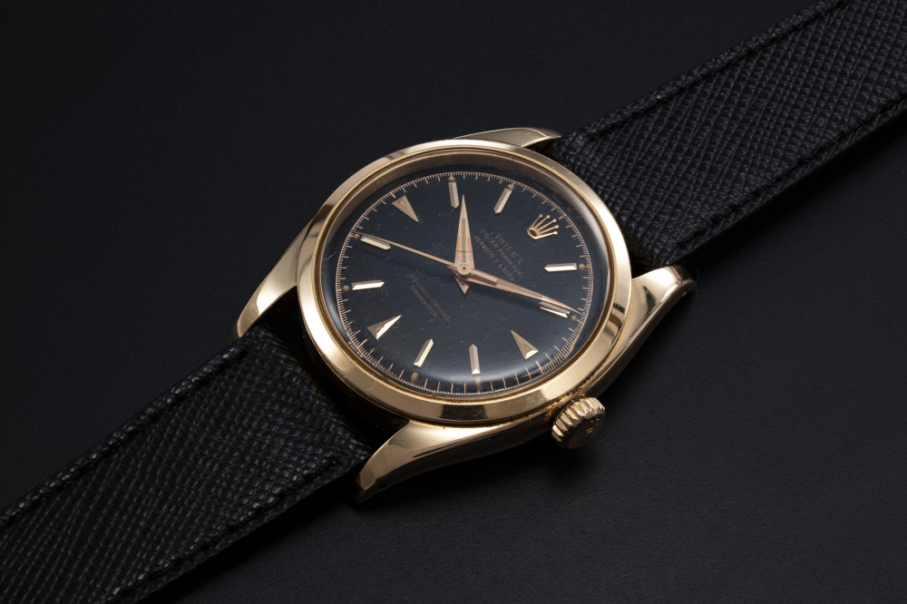 ROLEX, A RARE GOLD OYSTER PERPETUAL WITH A GLOSS DIAL AND SIGNATURE OF RETAILER SERPICO Y LAINO, REF. 6298 - CASE