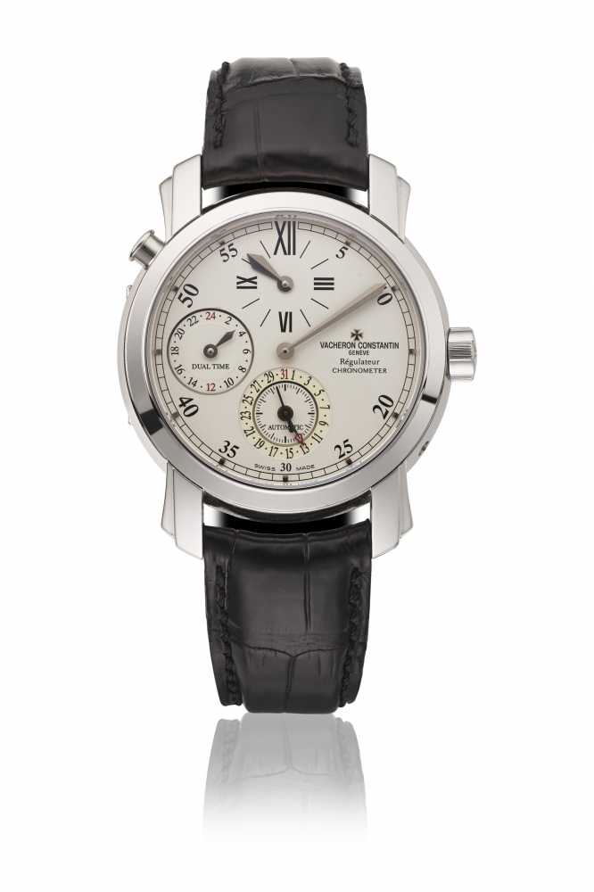 VACHERON CONSTANTIN. AN 18K WHITE GOLD AUTOMATIC DUAL TIME WRISTWATCH WITH DATE AND REGULATOR-STYLE DIAL