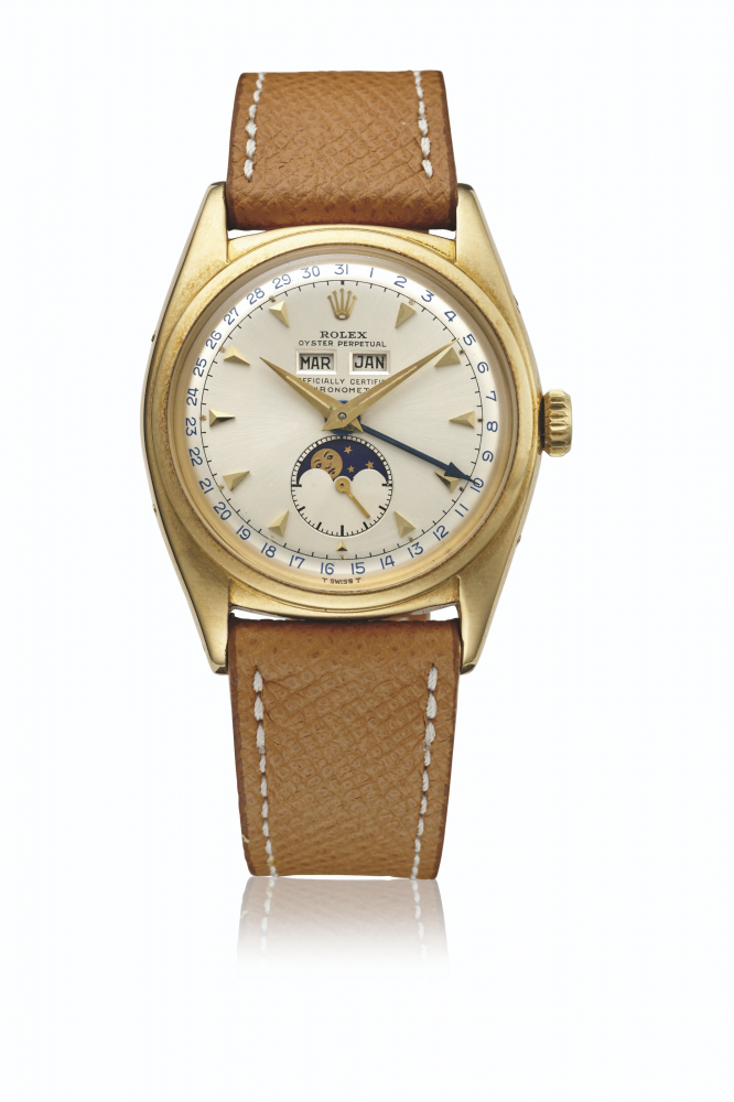 ROLEX. AN EXTREMELY RARE 18K GOLD AUTOMATIC TRIPLE CALENDAR WRISTWATCH WITH MOON PHASES AND SERVICE DIAL