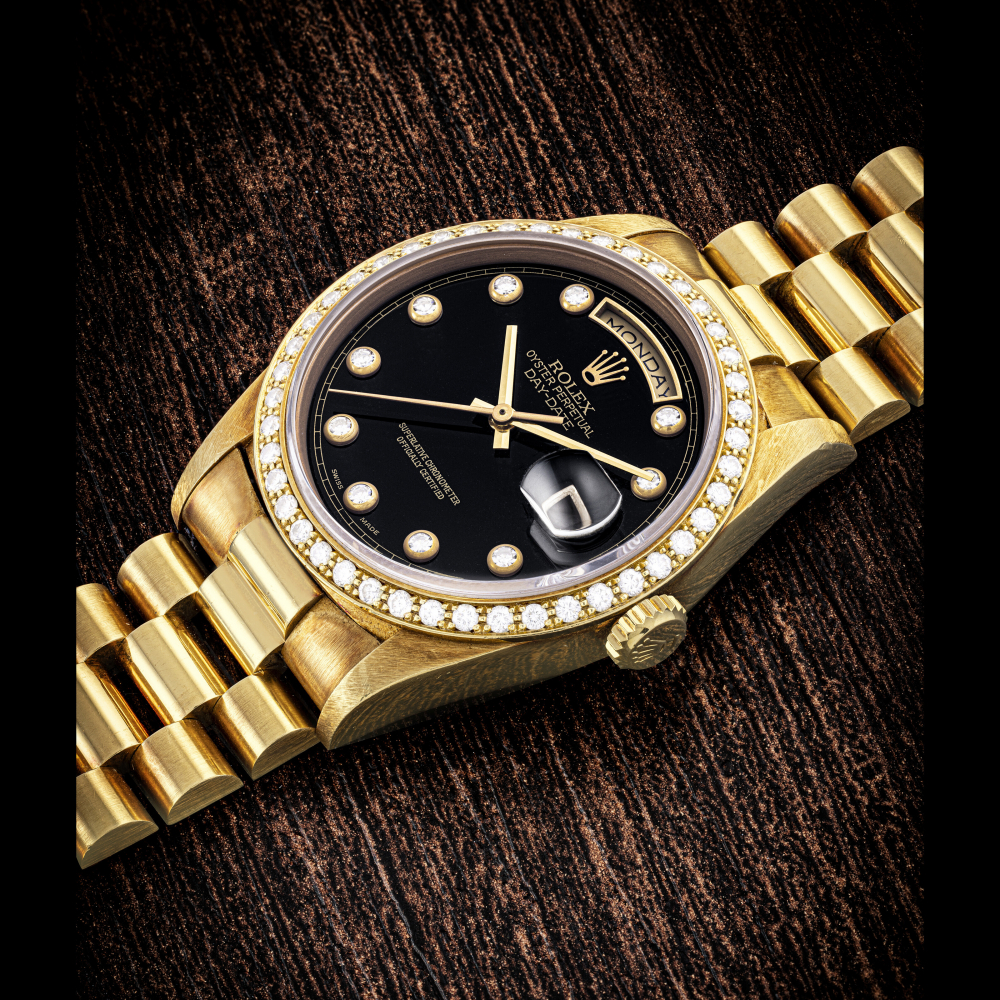 ROLEX. A RARE 18K GOLD AND DIAMOND-SET AUTOMATIC WRISTWATCH WITH SWEEP CENTRE SECONDS DAY DATE BRACELET AND ONYX DIAL