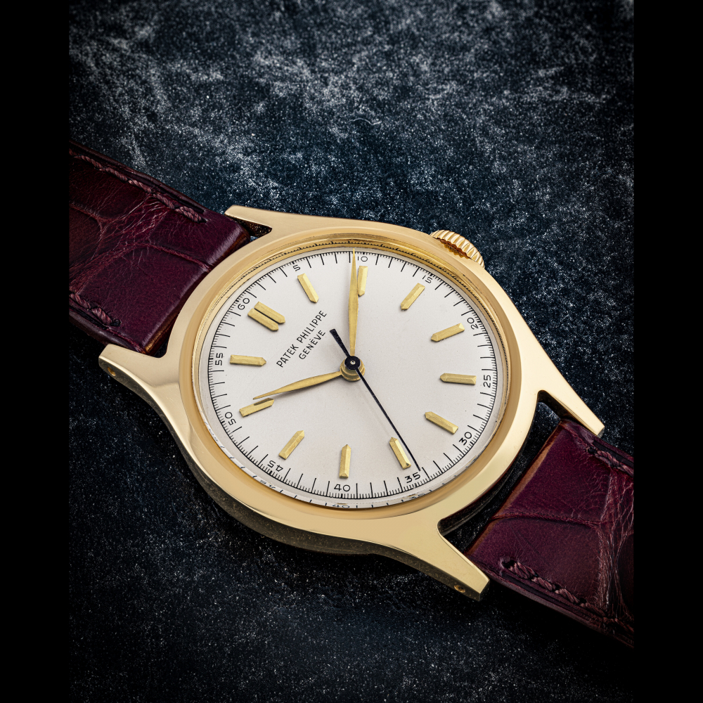 PATEK PHILIPPE. AN 18K GOLD WRISTWATCH WITH SWEEP CENTRE SECONDS