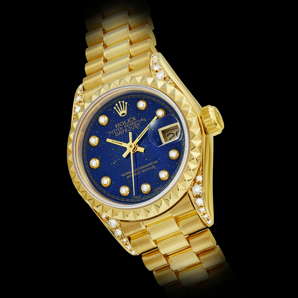 ROLEX. A LADY’S 18K GOLD AND DIAMOND-SET AUTOMATIC WRISTWATCH WITH SWEEP CENTRE SECONDS, DATE, BRACELET AND LAPIS LAZULI DIAL