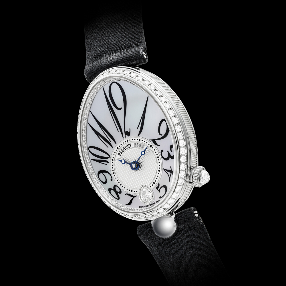 BREGUET. A LADY’S 18K WHITE GOLD AND DIAMOND-SET AUTOMATIC WRISTWATCH WITH MOTHER-OF-PEARL DIAL