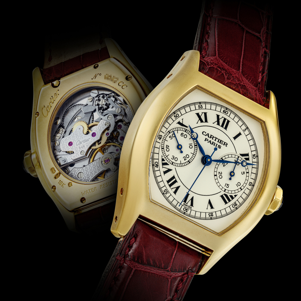 CARTIER. AN 18K GOLD TONNEAU SHAPE SINGLE BUTTON CHRONOGRAPH WRISTWATCH