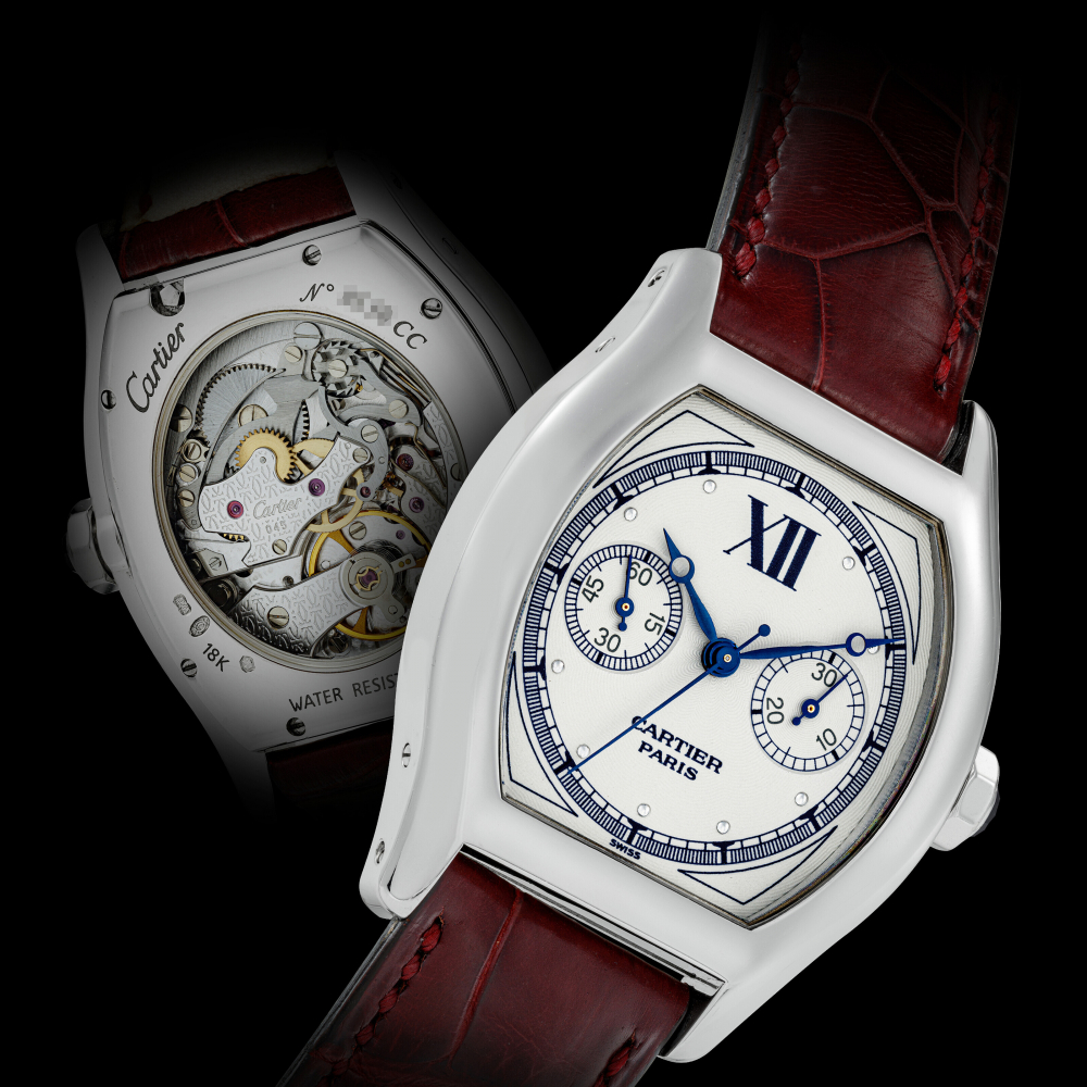 CARTIER. AN 18K WHITE GOLD TONNEAU SHAPE SINGLE BUTTON CHRONOGRAPH WRISTWATCH