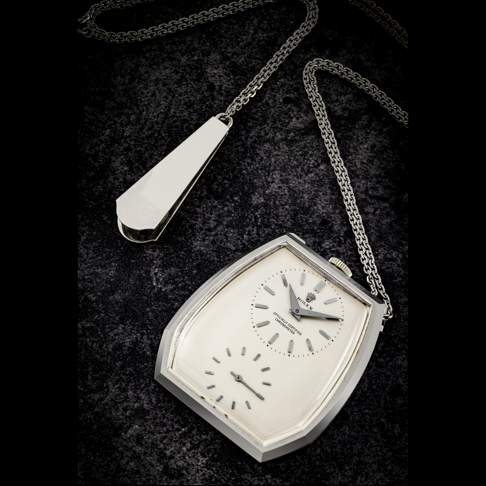 ROLEX. AN 18K WHITE GOLD POCKET WATCH WITH CHAIN