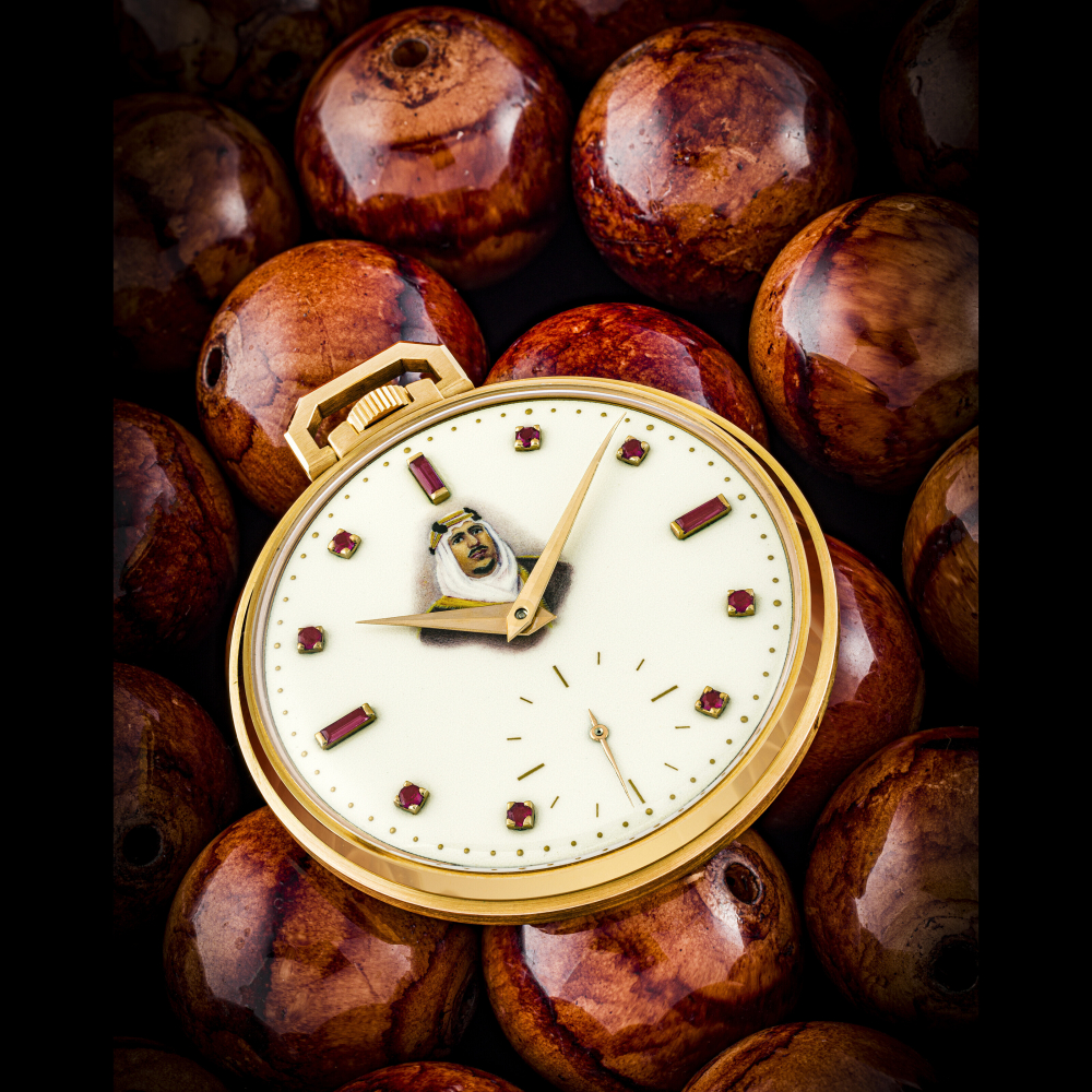 PATEK PHILIPPE. A VERY RARE 18K PINK GOLD POCKET WATCH WITH RUBY-SET ENAMEL DIAL WITH PAINTED PORTRAIT OF KING OF SAUDI ARABIA