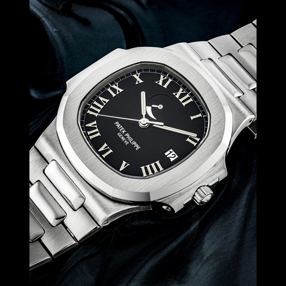 PATEK PHILIPPE. A STAINLESS STEEL AUTOMATIC WRISTWATCH WITH SWEEP CENTRE SECONDS, DATE, POWER RESERVE AND BRACELET
