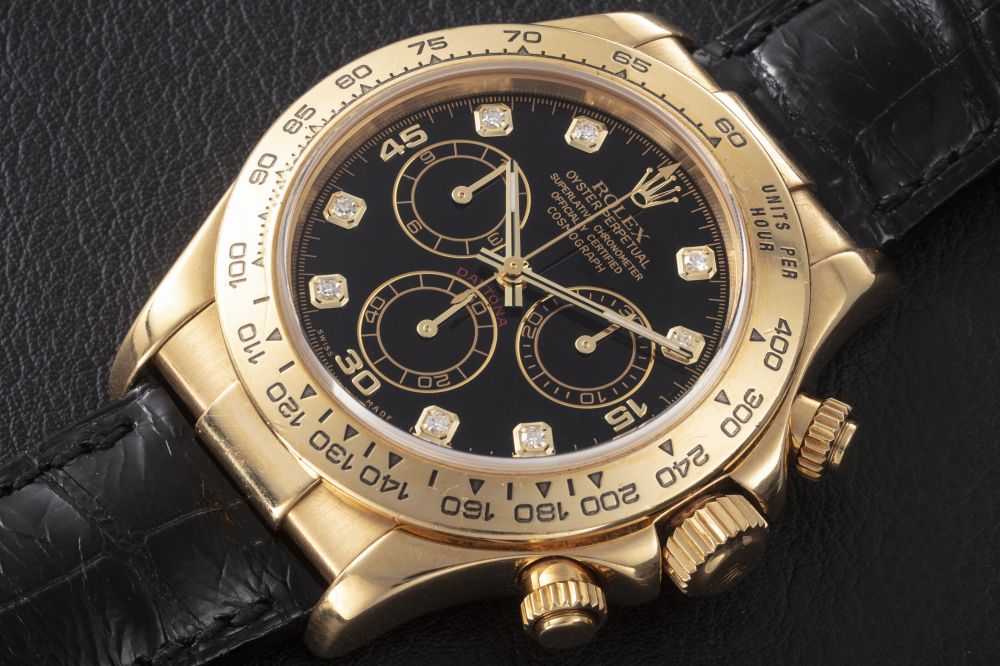 ROLEX, DAYTONA REF. 116518, A GOLD AUTOMATIC CHRONOGRAPH WRISTWATCH WITH DIAMOND-SET DIAL - CASE