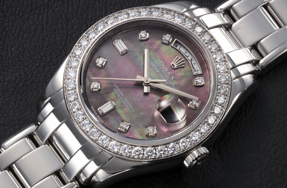 ROLEX, DAY-DATE REF. 18946, A PLATINUM AND DIAMOND-SET WRISTWATCH WITH BLACK MOTHER-OF-PEARL DIAL - CASE