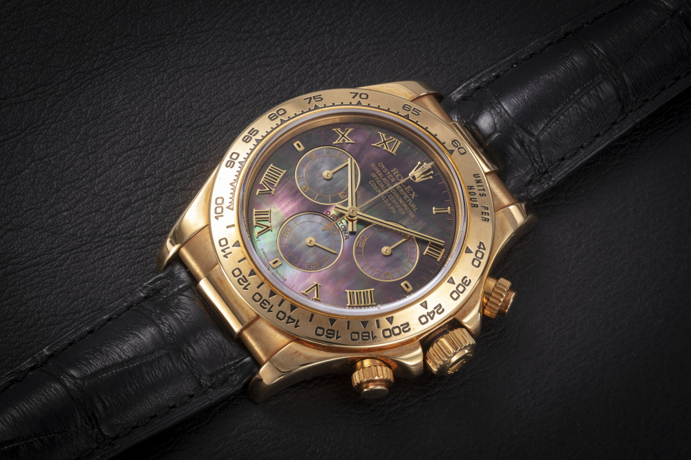 ROLEX, DAYTONA REF. 116518, GOLD AUTOMATIC CHRONOGRAPH WITH MOTHER-OF-PEARL DIAL - CASE
