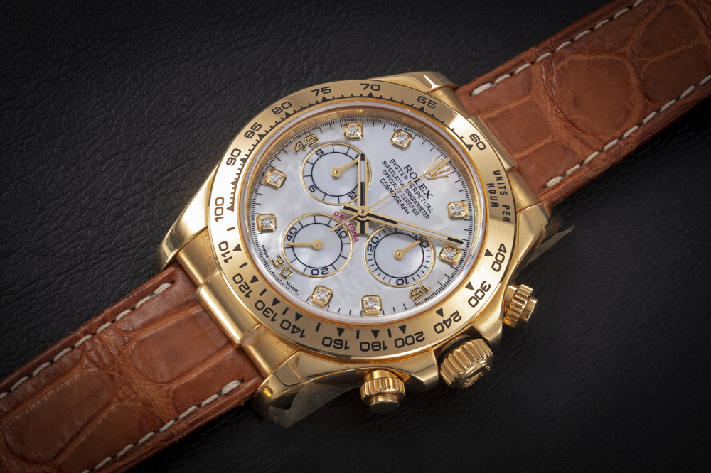 ROLEX, DAYTONA REF. 116518, A GOLD CHRONOGRAPH WRISTWATCH WITH MOTHER-OF-PEARL DIAL - CASE
