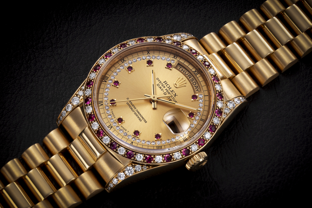 ROLEX, DAY-DATE REF. 18388, A RARE GOLD, DIAMOND AND RUBY-SET AUTOMATIC WRISTWATCH - CASE
