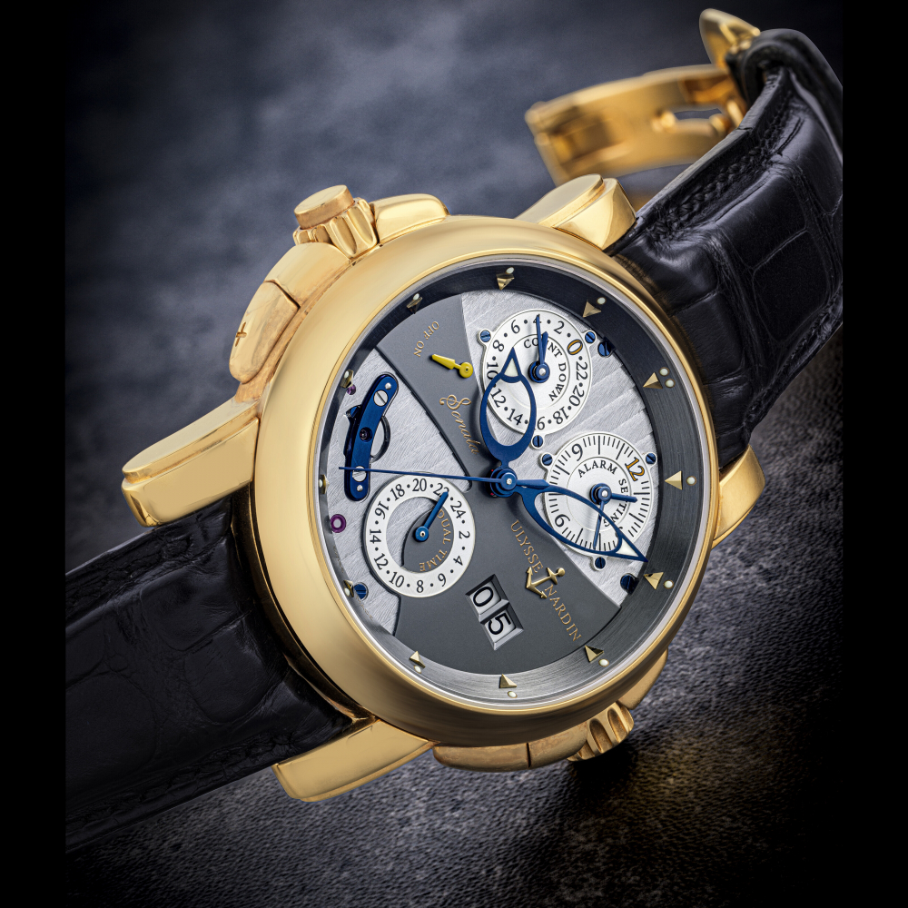 ULYSSE NARDIN. AN 18K GOLD AUTOMATIC DUAL TIME WRISTWATCH WITH SWEEP CENTRE SECONDS, DATE, ALARM AND COUNTDOWN INDICATION