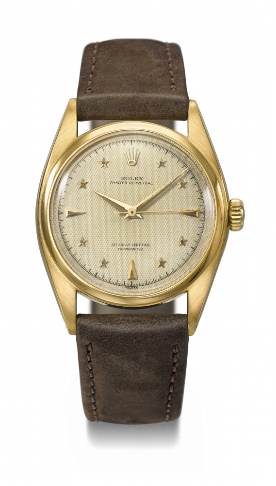 ROLEX. AN EXCEEDINGLY RARE AND HIGHLY ATTRACTIVE 18K GOLD AUTOMATIC WRISTWATCH WITH SWEEP CENTRE SECONDS AND LUMINOUS HONEYCOMB STAR DIAL