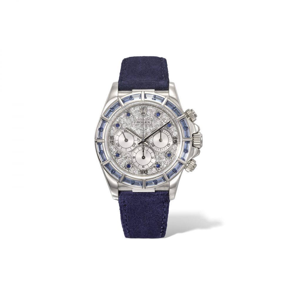 ROLEX. A VERY RARE AND HIGHLY ATTRACTIVE 18K WHITE GOLD, DIAMOND AND SAPPHIRE-SET AUTOMATIC CHRONOGRAPH WRISTWATCH WITH BAGUETTE-CUT SAPPHIRE BEZEL