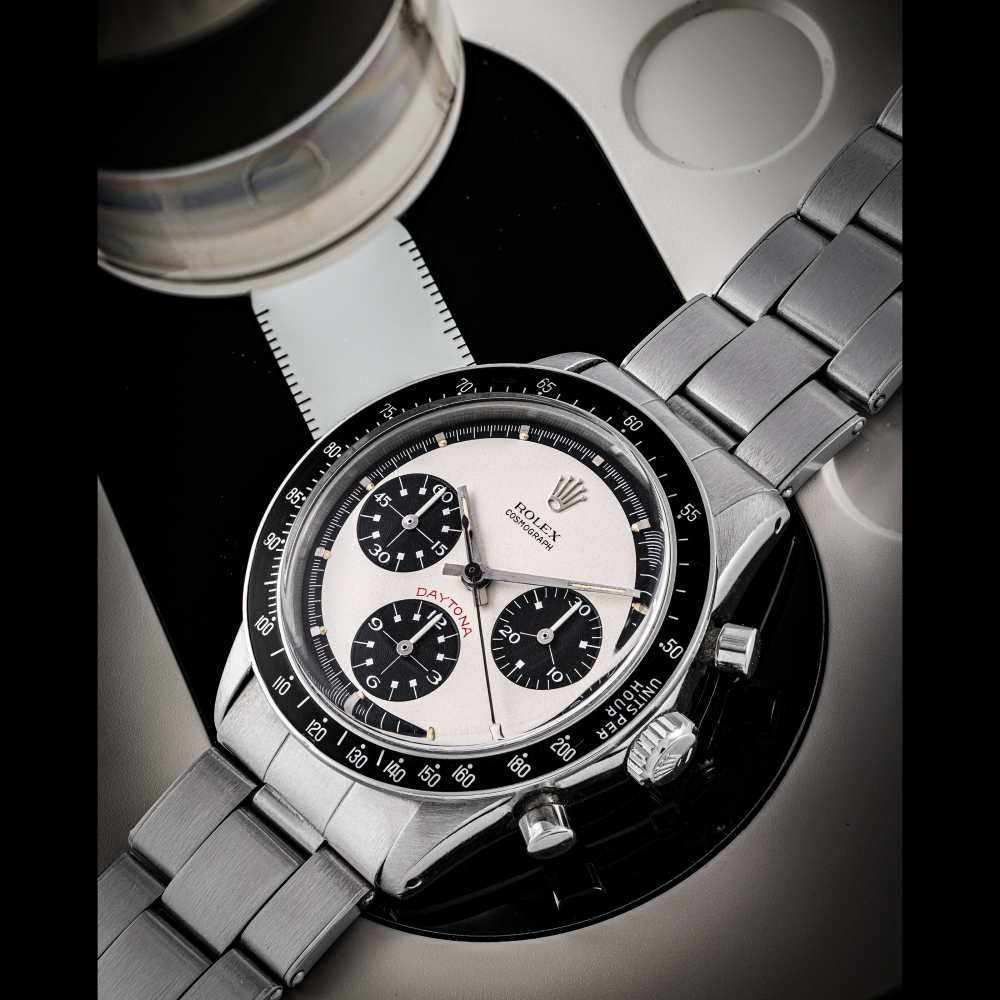 ROLEX. A VERY RARE AND WELL PRESERVED STAINLESS STEEL CHRONOGRAPH WRISTWATCH WITH BRACELET AND “PAUL NEWMAN” DIAL