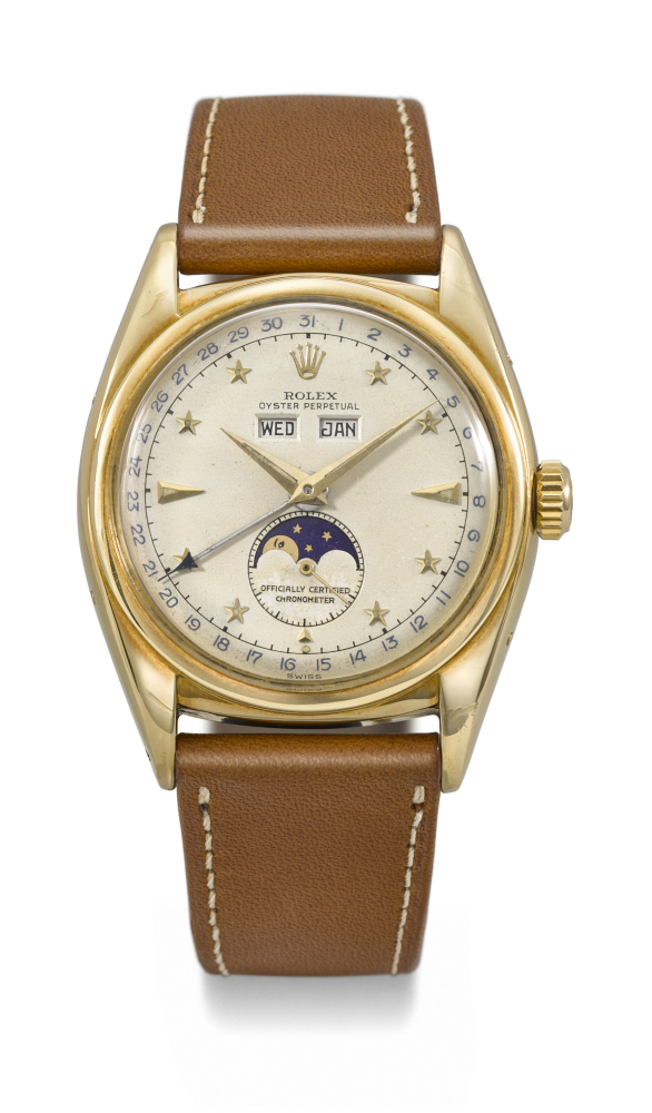 ROLEX. AN EXCEEDINGLY RARE AND WELL PRESERVED 18K GOLD AUTOMATIC TRIPLE CALENDAR WRISTWATCH WITH MOON PHASES AND STAR HOUR MARKERS