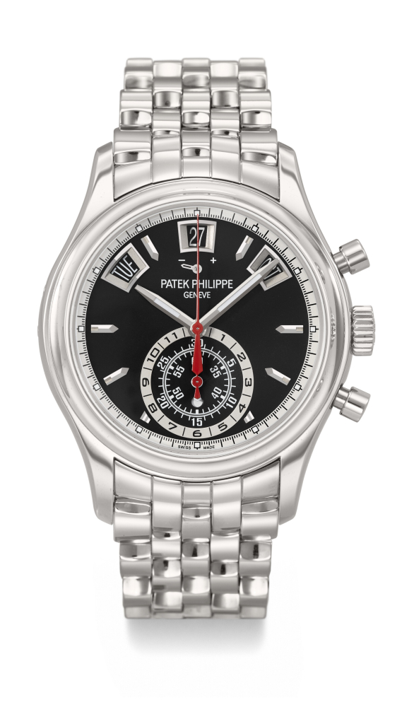 PATEK PHILIPPE. A VERY RARE AND ATTRACTIVE STAINLESS STEEL AUTOMATIC ANNUAL CALENDAR FLYBACK CHRONOGRAPH WRISTWATCH WITH POWER RESERVE, DAY/NIGHT INDICATOR AND BRACELET