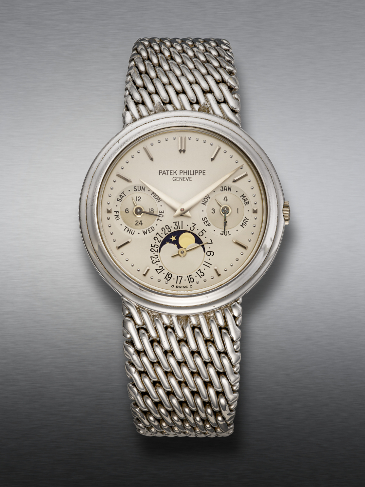 PATEK PHILIPPE, EXTREMELY RARE WHITE GOLD PERPETUAL CALENDAR WRISTWATCH, WITH MOON PHASES, REF. 3945/1