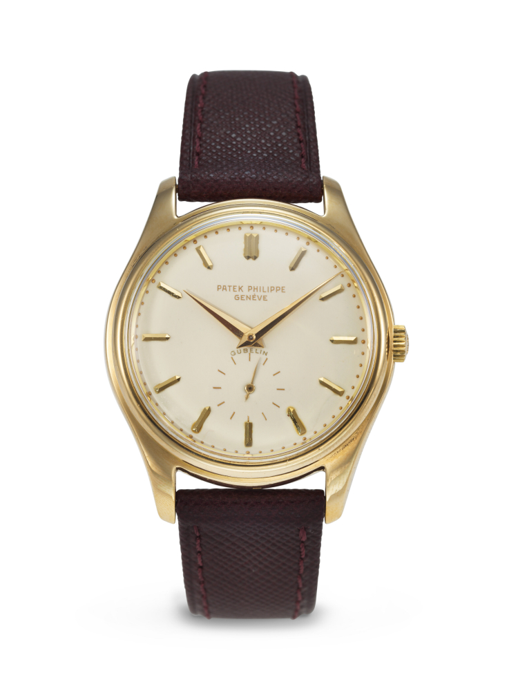 PATEK PHILIPPE. A VERY RARE AND ELEGANT 18K GOLD AUTOMATIC WRISTWATCH WITH CREAM-COLOURED ENAMEL DIAL