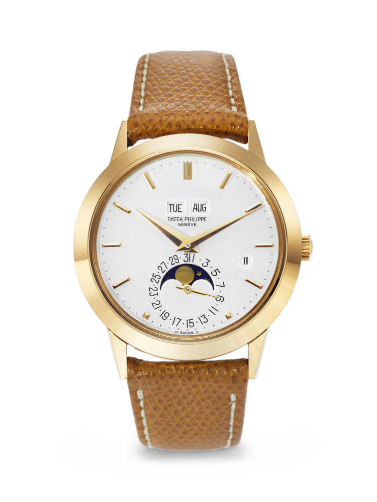 PATEK PHILIPPE. A RARE AND ELEGANT 18K GOLD AUTOMATIC PERPETUAL CALENDAR WRISTWATCH WITH MOON PHASES AND LEAP YEAR INDICATION