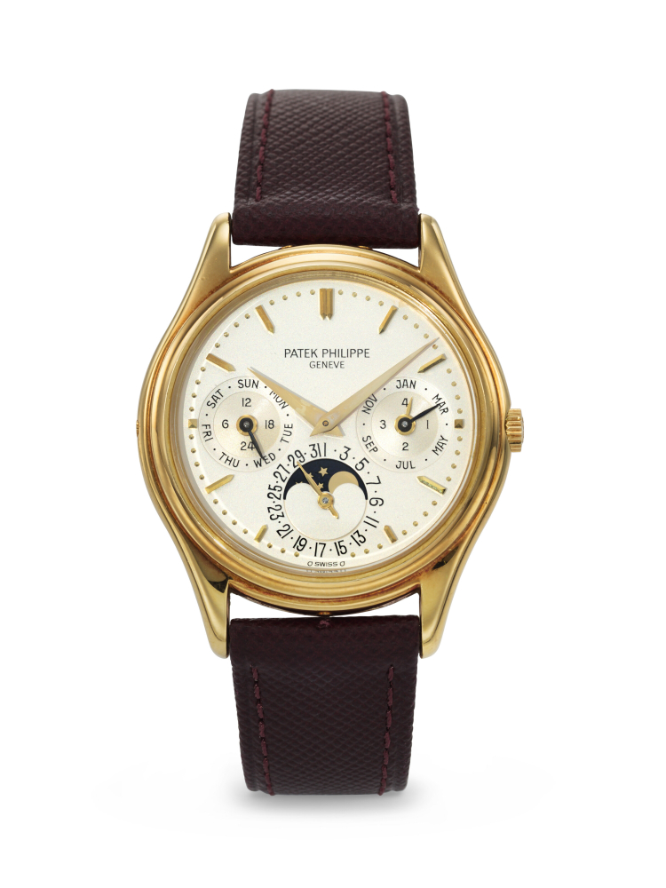 PATEK PHILIPPE. A RARE AND ELEGANT 18K GOLD AUTOMATIC PERPETUAL CALENDAR WRISTWATCH WITH MOON PHASES, 24-HOUR, AND LEAP YEAR INDICATION