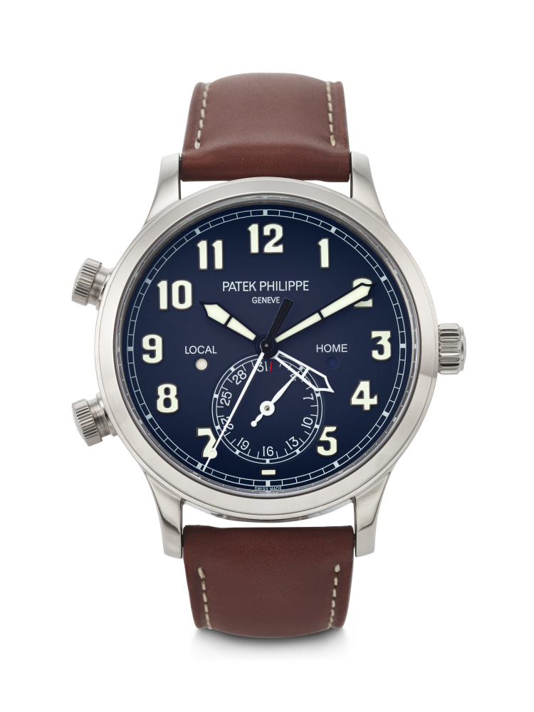 PATEK PHILIPPE. AN ATTRACTIVE 18K WHITE GOLD AUTOMATIC DUAL TIME WRISTWATCH WITH SWEEP CENTRE SECONDS, DAY/NIGHT INDICATION AND DATE