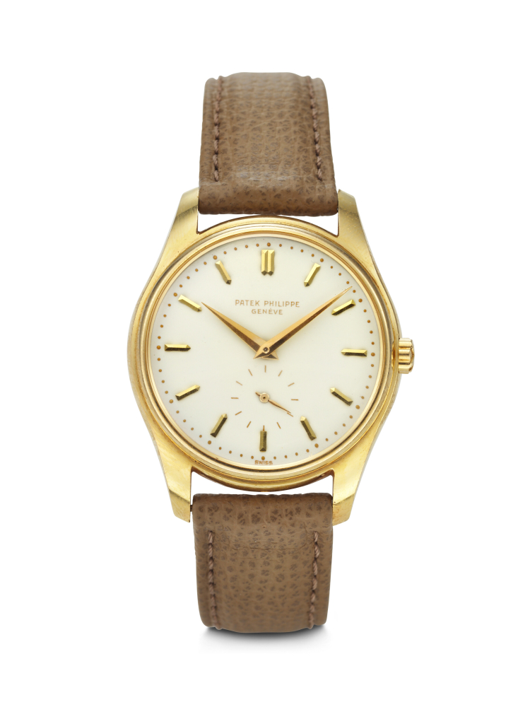 PATEK PHILIPPE. A VERY RARE AND AND ELEGANT 18K GOLD AUTOMATIC WRISTWATCH WITH CREAM-COLORED ENAMEL DIAL