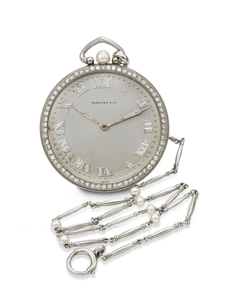 C.H. MEYLAN FOR TIFFANY CO., AN OPULENT AND ULTRA-THIN PLATINUM, DIAMOND, AND PEARL-SET OPEN-FACE WATCH WITH PLATINUM AND PEARL CHAIN