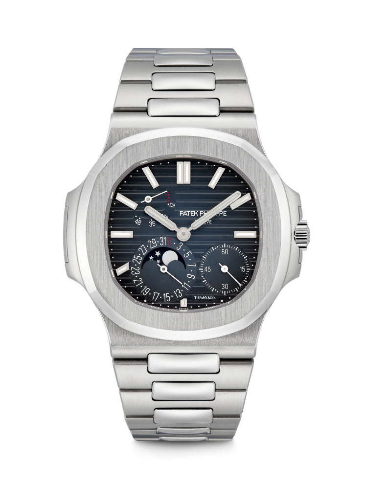 PATEK PHILIPPE. AN EXTREMELY RARE STAINLESS STEEL AUTOMATIC WRISTWATCH WITH MOON PHASES, DATE, POWER RESERVE AND BRACELET, RETAILED BY TIFFANY CO. 