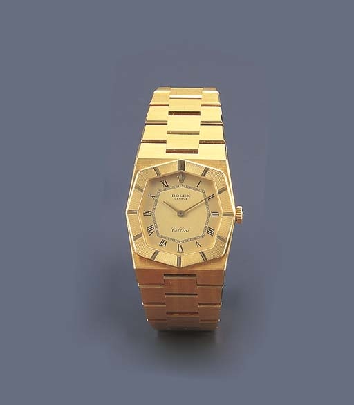 ROLEX. A LADY'S 18K GOLD TONNEAU-SHAPED WRISTWATCH WITH BRACELET
