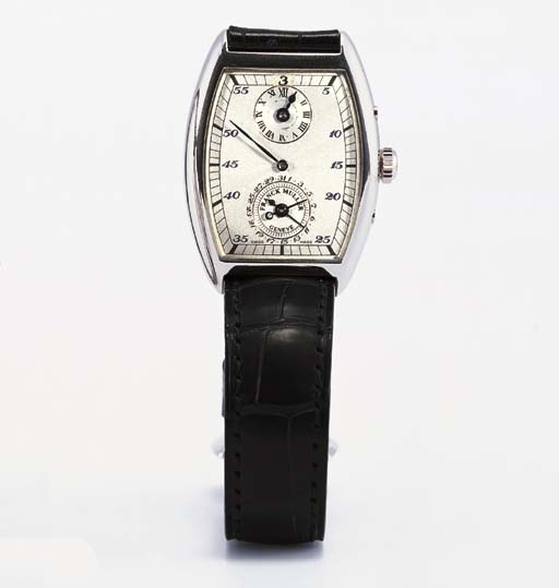 FRANCK MULLER. A VERY RARE LIMITED EDITION PLATINUM TONNEAU-SHAPED DUAL JUMPING HOUR WRISTWATCH