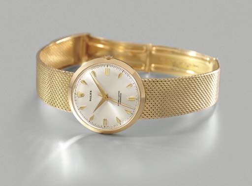 Rolex. A rare 18K gold wristwatch with sweep centre seconds and bracelet