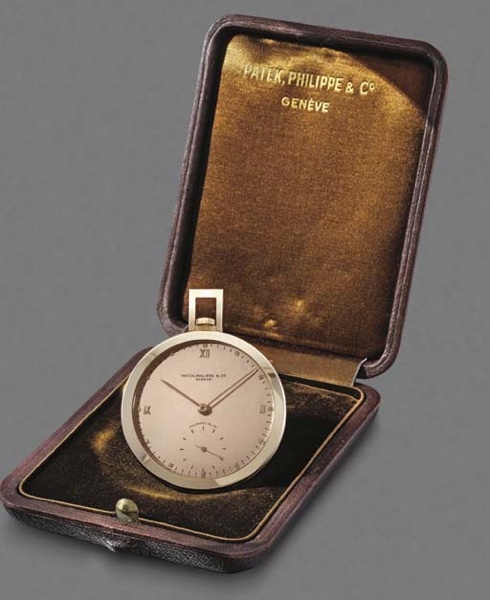 Patek Philippe. A fine 18K pink gold openface keyless lever dress watch with pink dial