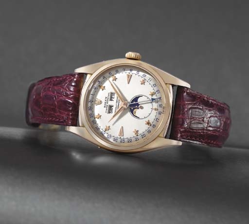Rolex. A very fine and extremely rare 18K pink gold self-winding waterproof triple calendar wristwatch with phases of the moon and star dial