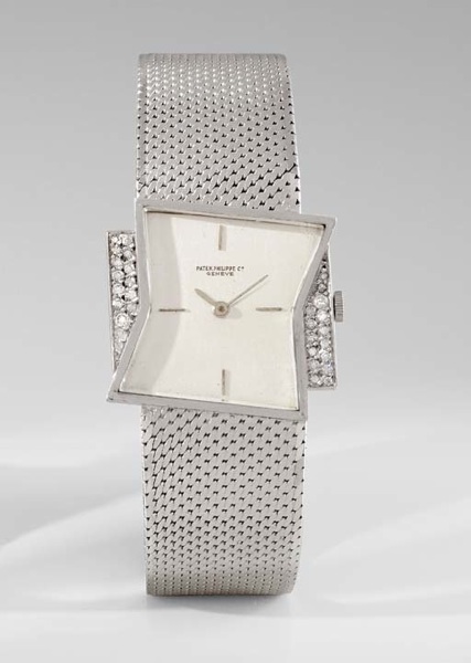 Patek Philippe. An extremely fine and rare platinum and diamond-set asymmetrical wristwatch with bracelet