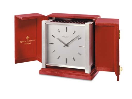 Patek Philippe. A rare rhodium-plated brass square solar-powered desk clock