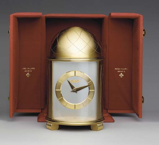 Patek Philippe. A fine and unusual gilt brass solar-powered table clock