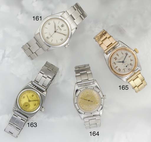 Rolex. A stainless steel mid-size water resistant wristwatch