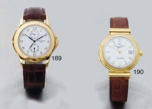 International Watch Co. An 18ct Gold Automatic Centre Seconds Calendar Watch with hinged Crystal back