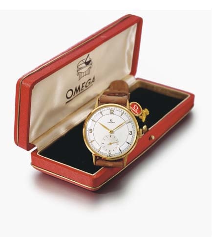 Omega. An 18K gold wristwatch with two-tone silvered dial