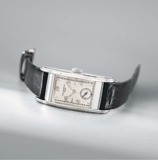 Patek Philippe. A fine and rare large stainless steel rectangular curved wristwatch
