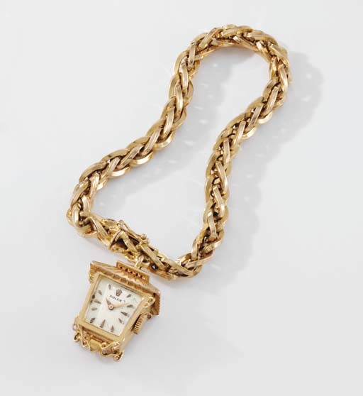 Rolex. An unusual 18K pink gold lantern-form watch