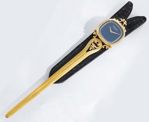 Patek Philippe. A rare and unusual limited edition 18K gold letter opener with watch and unique hand-engraved decoration