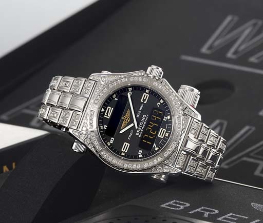BREITLING. A VERY RARE LIMITED EDITION 18K WHITE GOLD AND DIAMOND-SET MULTI-FUNCTIONAL WRISTWATCH WITH EMERGENCY TRANSMITTER, DIGITAL DISPLAY FOR ALARM, DAY, DATE, CHRONOGRAPH, COUNTDOWN TIMER AND SECOND TIME ZONE AND BRACELET