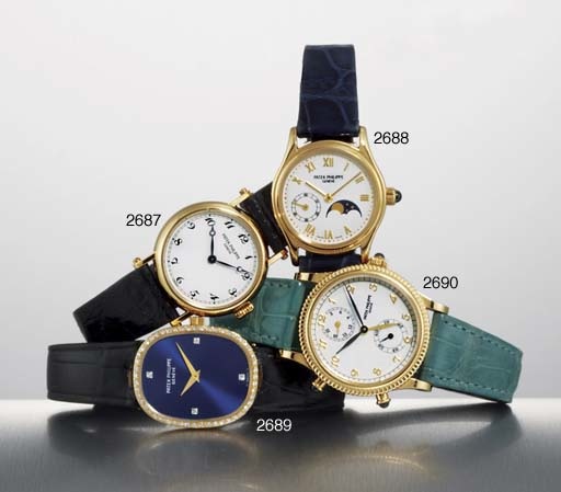 PATEK PHILIPPE. A FINE LADY'S 18K GOLD WRISTWATCH WITH PHASES OF THE MOON