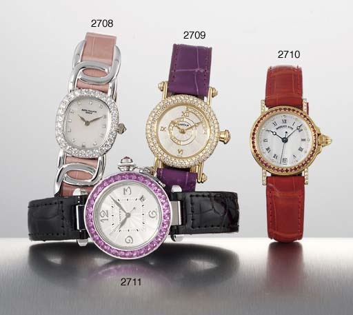PATEK PHILIPPE. A FINE LADY'S 18K WHITE GOLD AND DIAMOND-SET OVAL WRISTWATCH WITH MOTHER-OF-PEARL DIAL